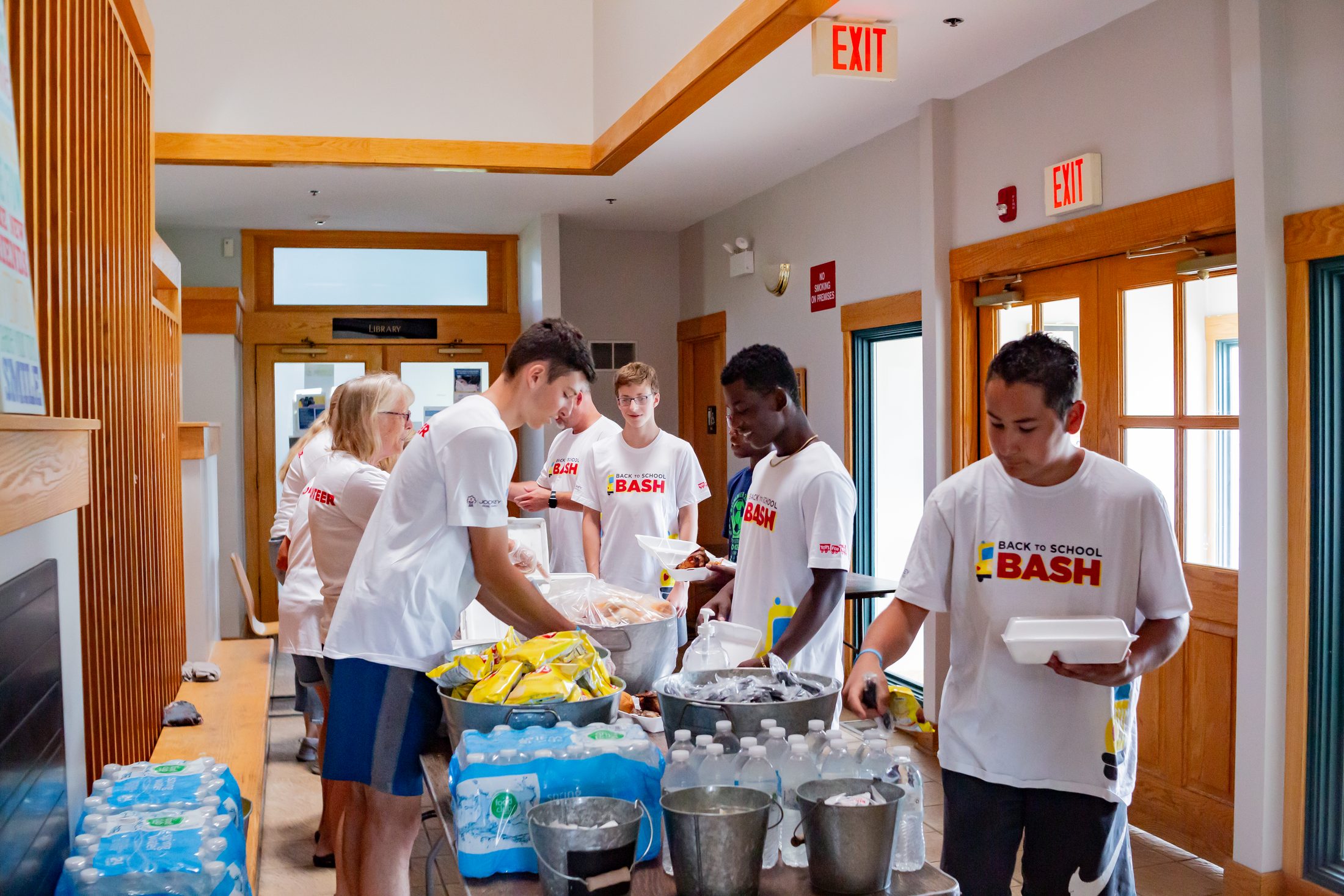 Back to School Bash, volunteers serving food to families